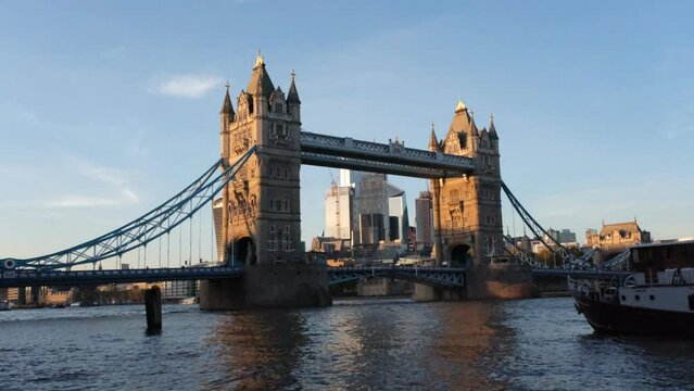 Tower Bridge London with Thames river and floating boat from the right