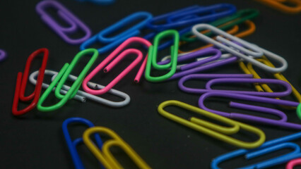 Paper clip isolated on a black background