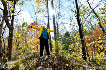 Funny happy child in autumn forest