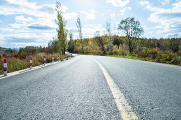 Empty asphalt road and colorful autumn scene