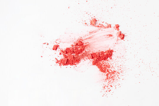 Abstract crush and smushed pink blush powder or eye shadow on white background.Make up swatch