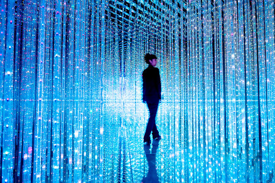 Businesswoman walking in the beautiful bokeh light