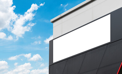 Mock up billboard on building with blue sky background