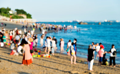 Blurred people having beach party in summer vacation