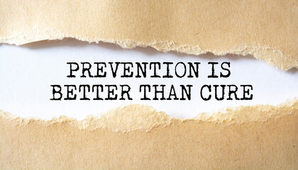 Prevention is Better than Cure word written under torn paper.