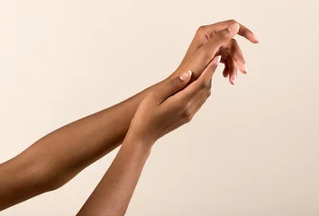 Wandaufkleber Gentle black female hands with natural manicure © photology1971