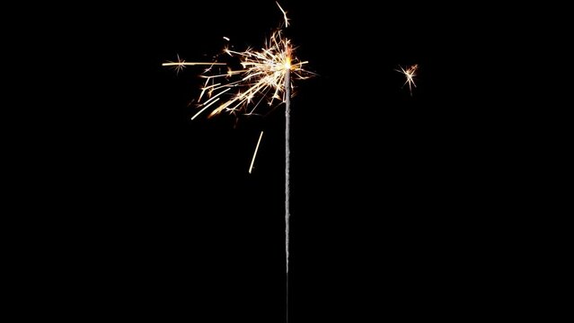 Lightening sparkler or Bengal lights on a black background. The concept of the holiday of the new year, birthday