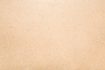 Light brown carton background. Closeup. Material for products packaging. Empty place for text. Top down view.	