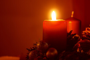 Burning candle and christmas decoration