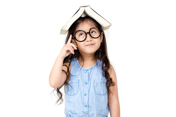 Portrait of lovely little Asian girl thinking and put a book on top with copy space isolated on...