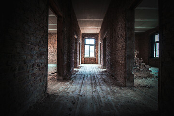 Fototapeta na wymiar rotten stone walls and a wooden floor in a lost place