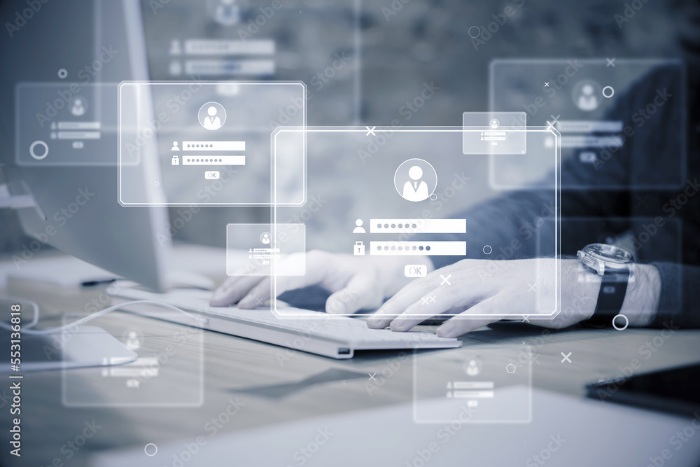 Poster businessman hands at desktop using laptop computer monitors and login details holograms on blurry of