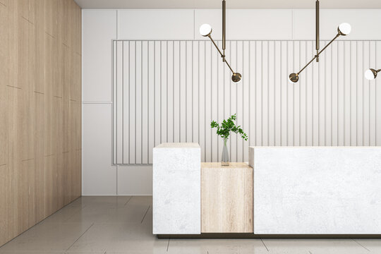 Front view on marble reception desk with green plant in glass vase on wooden surface in stylish spacious office hall with modern lamps on top and slatted light wall background. 3D rendering