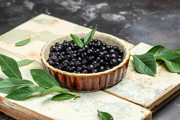 Bilberry. Superfoods antioxidant. Bowl of fresh berry on dark background, top view