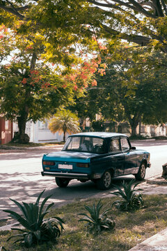 Cuba, Havana, Blue vintage car parked along street in La Vibora neighborhood