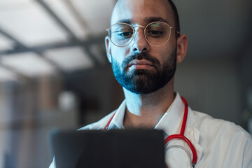 Doctor looking at tablet PC in hospital
