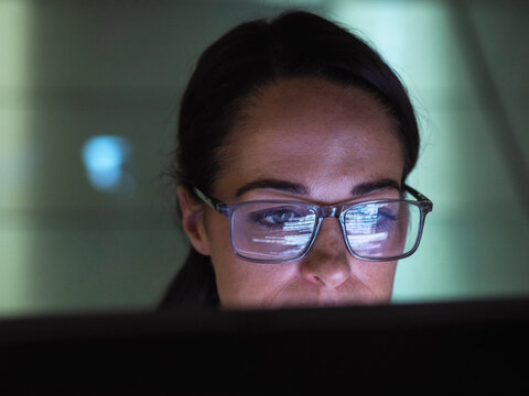 Focused programmer working on computer