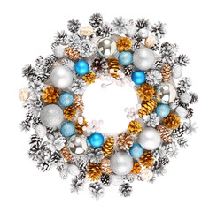 Handmade Christmas wreath decorated with blue and silver Christmas decorations, fir-cones. White background.
