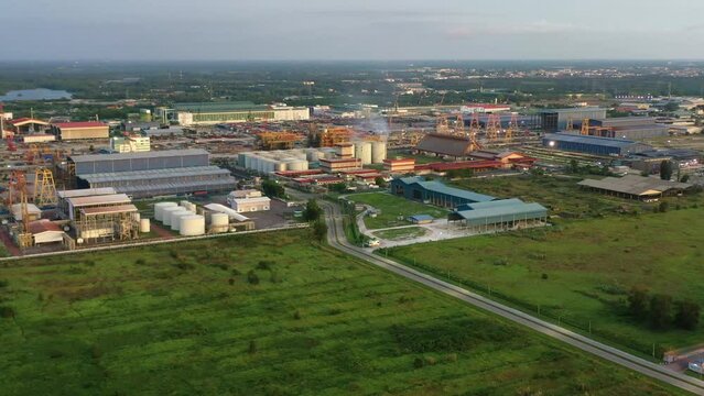 Aerial pan shot capturing massive area of lumut port industrial park, PGEO edible oil refinery food processing centre and sapura energy fabrication yard at Kampung Acheh, Sitiawan, Perak, Malaysia.