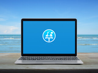 Service fix motorcycle with wrench tool flat icon on modern laptop computer screen on wooden table over tropical sea and blue sky with white clouds, Business repair motorcycle online service concept