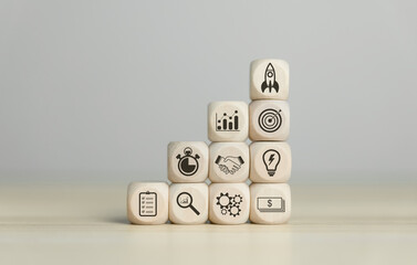 Wooden blocks showing a rocket icon Startup business 