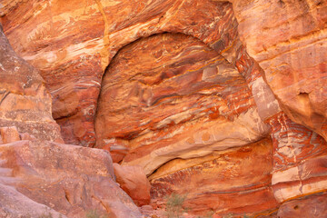Multi-colored sandstone rock and mineral layers in ancient tombs of Petra, Jordan. Pattern, geological stone texture