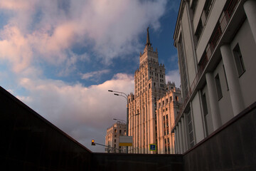 Stalinist architecture of the Soviet era. Stalin high-rise building on Sadovaya-Spasskaya street in Moscow. Evening cityscape at golden hour. Sunset. Bottom-up view.