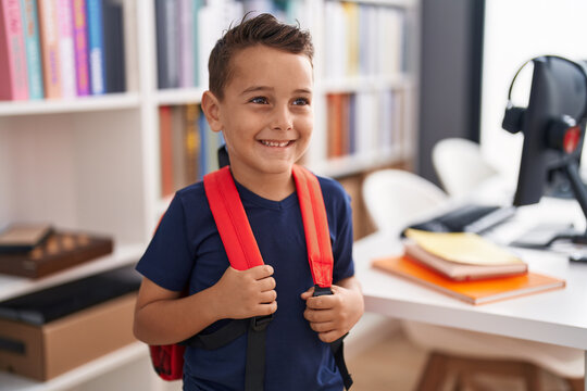 Adorable hispanic toddler student smiling confident standing at library school
