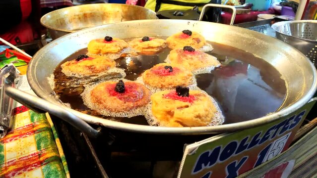 Fried muffins in Guatemala food stand. Molletes guatemaltecos. Central America Food stand