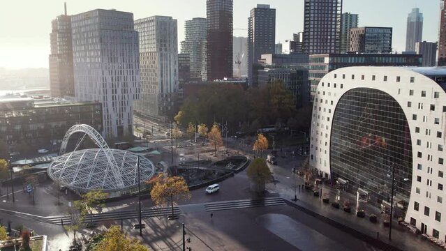 Markthal Building With Rotterdam Skyline In The Netherlands - aerial drone shot