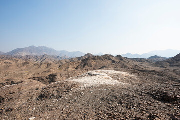 Horizontal landscape of the beautiful Hajar Mountains of the United Arab Emirates with clear blue sky, UAE,