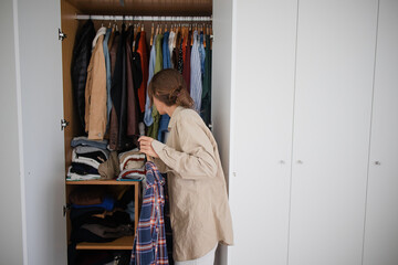 Cluttered Closet Messy Chaos Overwhelmed Woman Too Many Clothes Nothing to Wear