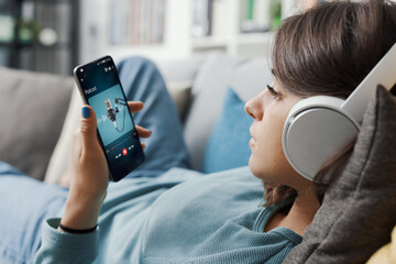 Woman listening to podcasts online