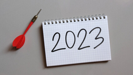 Goals concept, Notebook with 2023 goals text on it to apply new year resolutions and plan.