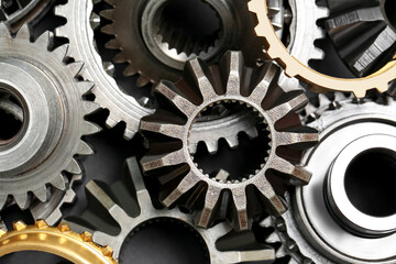 Many different stainless steel gears as background, top view