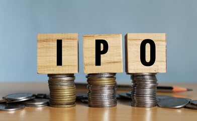 IPO - acronym from wooden blocks with letters, Initial Public Offering IPO concept, white...