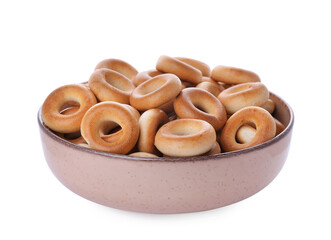 Bowl with tasty dry bagels (sushki) isolated on white