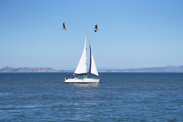sailboat. sailboat on the sea on a beautiful autumn day. blue sky. photo during the day.