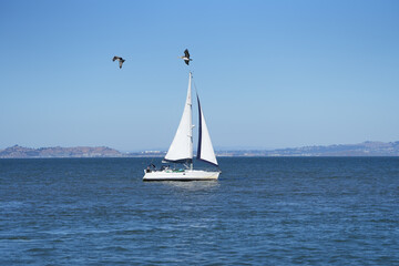 sailboat. sailboat on the sea on a beautiful autumn day. blue sky. photo during the day.