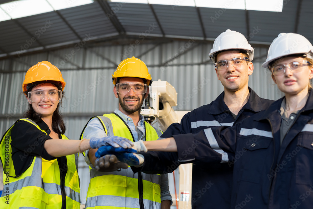 Poster Group of male and female engineer worker working together and control automatic robot arm system welding in the industry factory