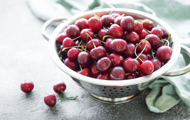Fresh red cherries fruit in collander