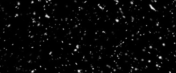 Falling snow isolated on black background. Falling snow at night. Bokeh lights on black background, flying snowflakes in the air. Winter weather. Overlay texture.