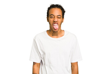 Fototapeta premium Young African American man isolated funny and friendly sticking out tongue.