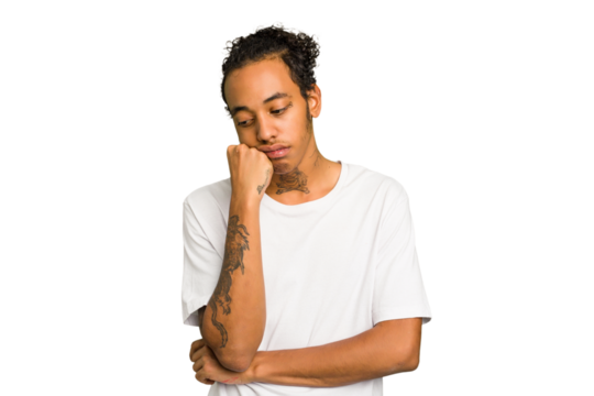 Young African American man isolated who feels sad and pensive, looking at copy space.