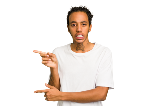 Young African American man isolated shocked pointing with index fingers to a copy space.
