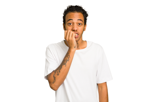 Young African American man isolated biting fingernails, nervous and very anxious.