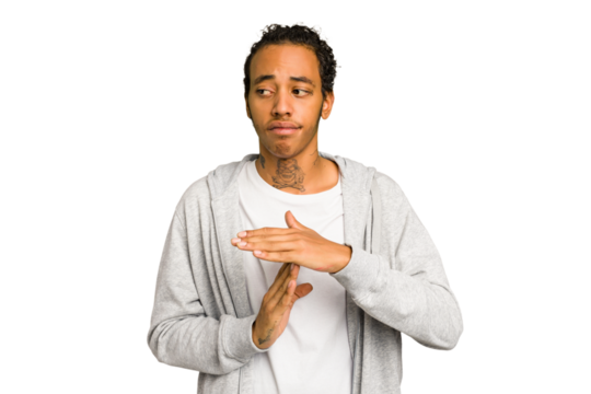 Young African American man isolated showing a timeout gesture.