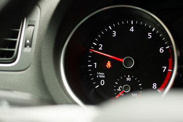 Odometer, rev counter and different vehicle or car controls, as well as climate control controls, lights, multifunction display, seat belt alert or gasoline level