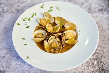 Clam stew plate on white marble table
