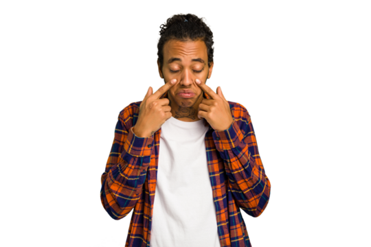 Young African American man isolated crying, unhappy with something, agony and confusion concept.